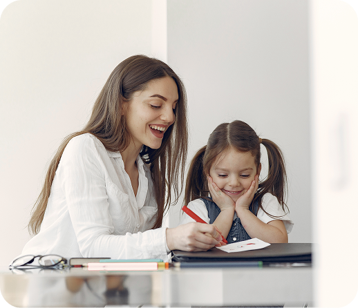 Tutor with little girl studying at home